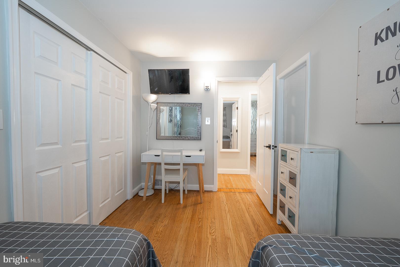 1022 Clover Hill Road Wynnewood, PA 19096 - Photo 20 of 40 a bedroom with a bed and a table in it