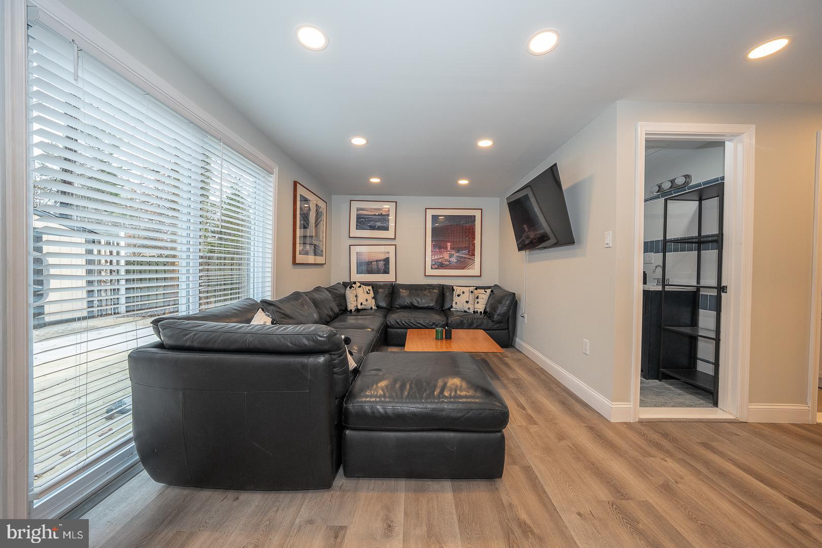 1022 Clover Hill Road Wynnewood, PA 19096 - Photo 24 of 40 a living room with furniture and a flat screen tv