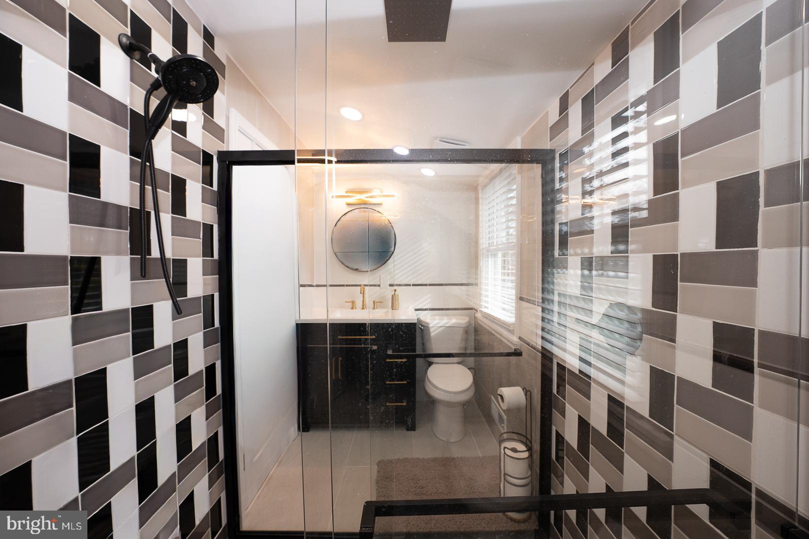 1022 Clover Hill Road Wynnewood, PA 19096 - Photo 34 of 40 a bathroom with a glass shower door and a sink