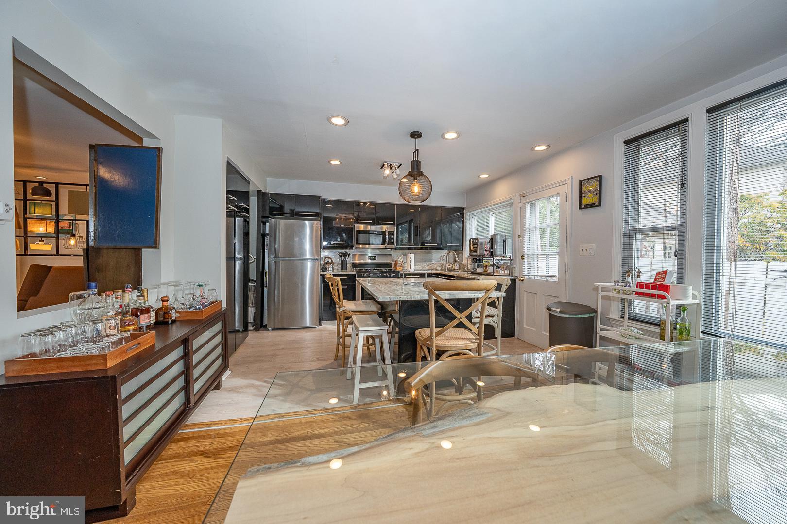 1022 Clover Hill Road Wynnewood, PA 19096 - Photo 9 of 40 a living room with lots of furniture and kitchen view