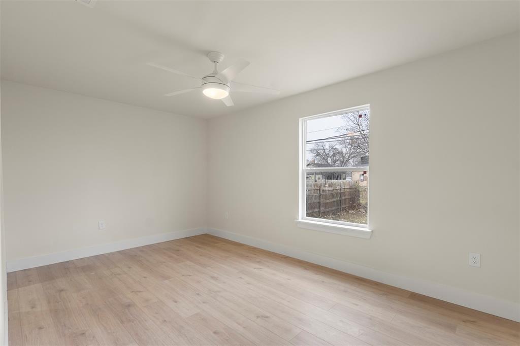 5124 Kilpatrick Avenue Fort Worth, TX 76107 - Photo 12 of 31 an empty room with a window