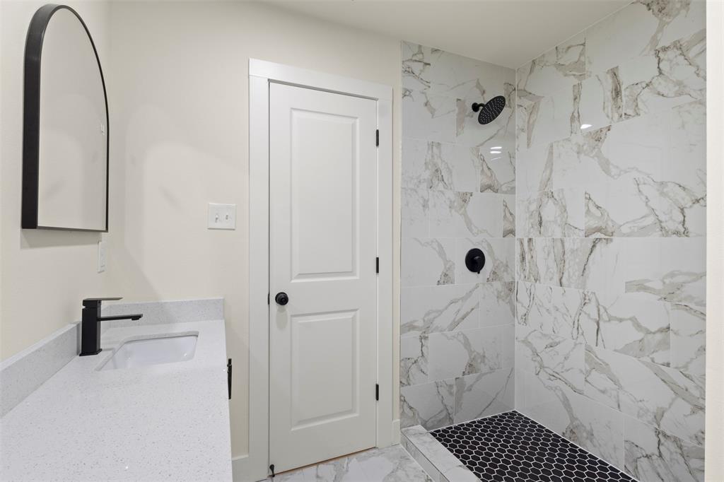 5124 Kilpatrick Avenue Fort Worth, TX 76107 - Photo 15 of 31 a bathroom with a shower