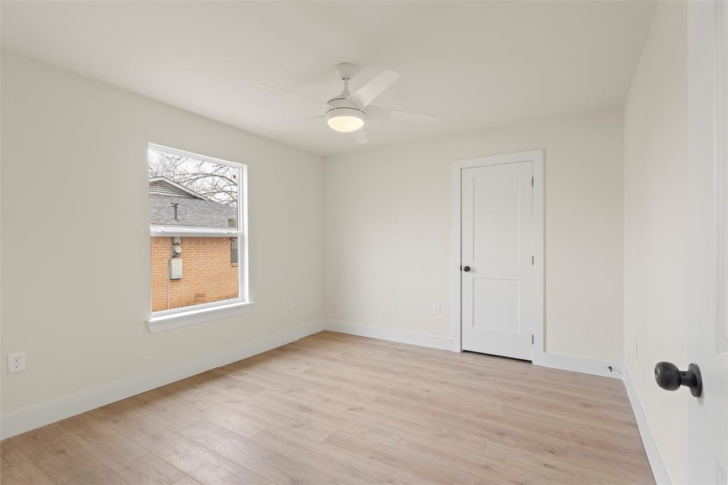 5124 Kilpatrick Avenue Fort Worth, TX 76107 - Photo 17 of 31 wooden floor in an empty room with a window