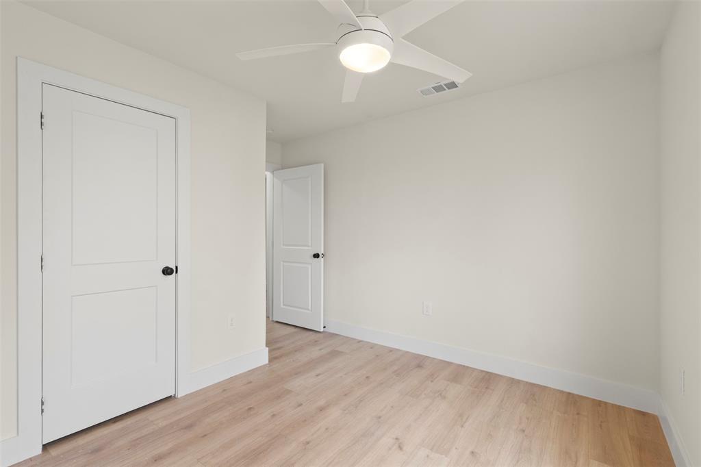 5124 Kilpatrick Avenue Fort Worth, TX 76107 - Photo 20 of 31 a view of an empty room with wooden floor