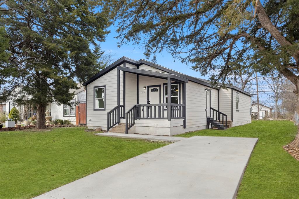 5124 Kilpatrick Avenue Fort Worth, TX 76107 - Photo 2 of 31 a front view of a house with a yard and trees