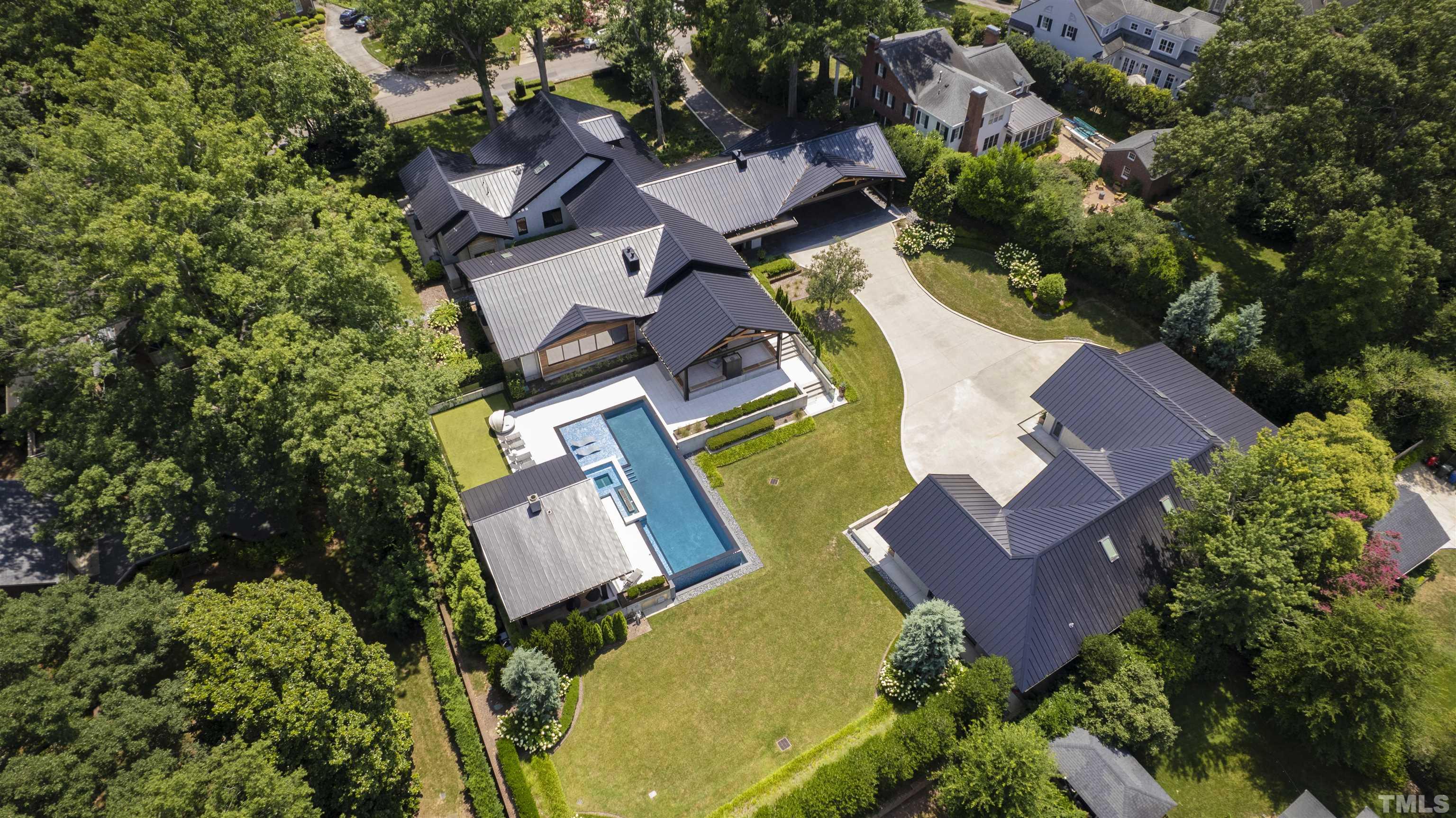 2315 Beechridge Road Raleigh, NC 27608 - Photo 2 of 78 an aerial view of a swimming pool with outdoor space and trees all around