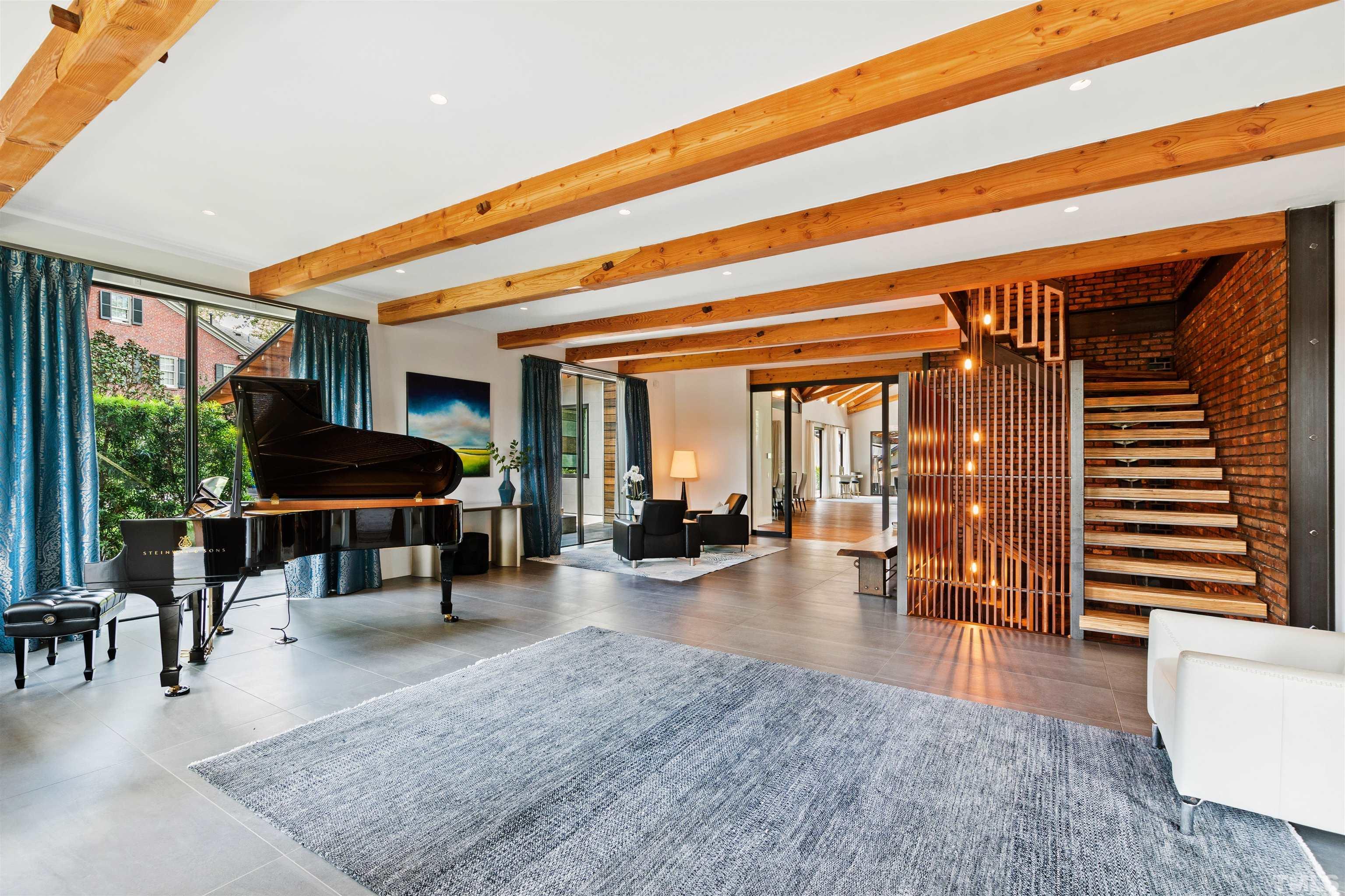 2315 Beechridge Road Raleigh, NC 27608 - Photo 28 of 78 a living room with furniture and a large window