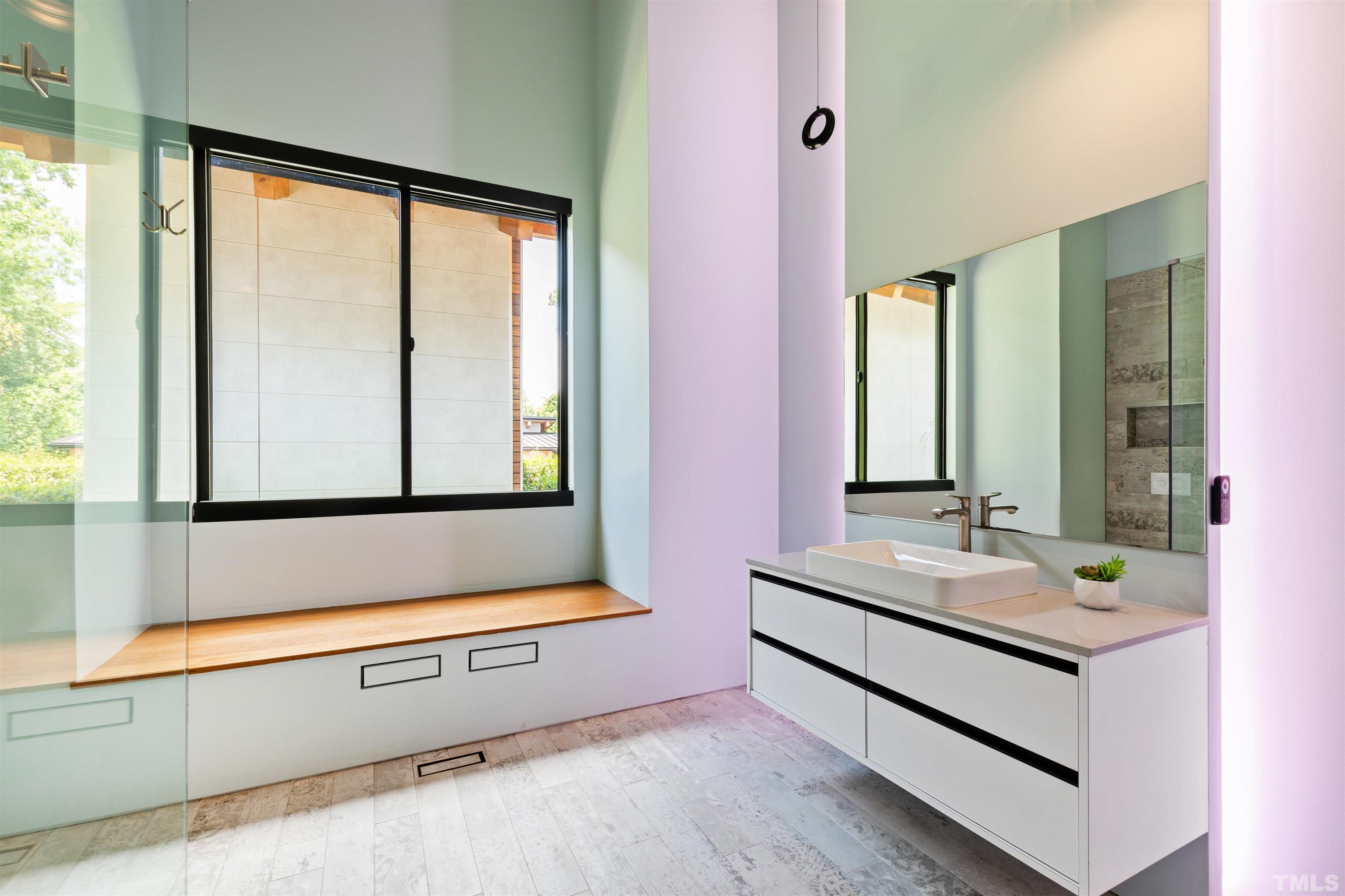 2315 Beechridge Road Raleigh, NC 27608 - Photo 39 of 78 a bathroom with a sink and a mirror