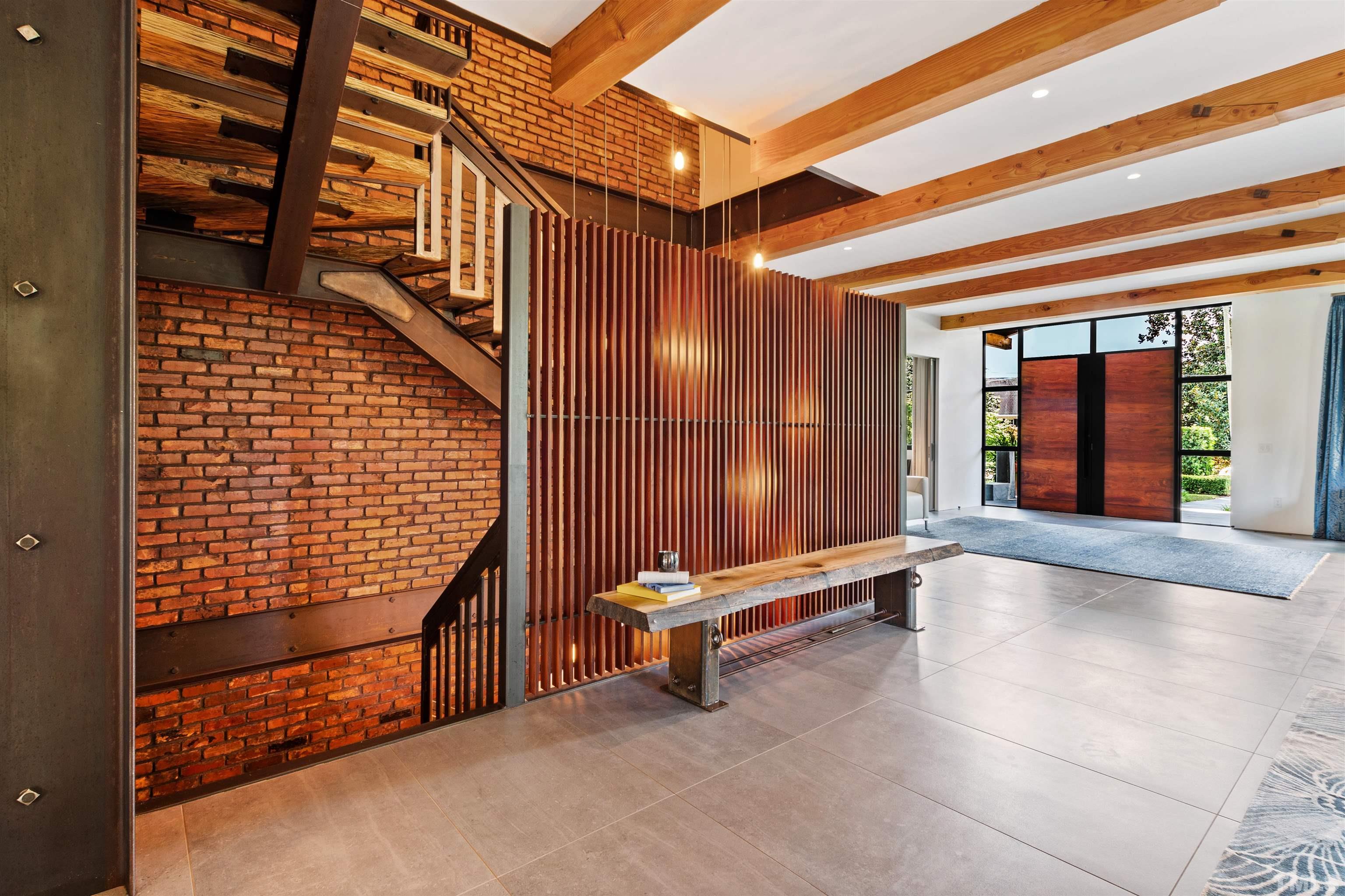 2315 Beechridge Road Raleigh, NC 27608 - Photo 43 of 78 a view of an entryway with wooden floor and door