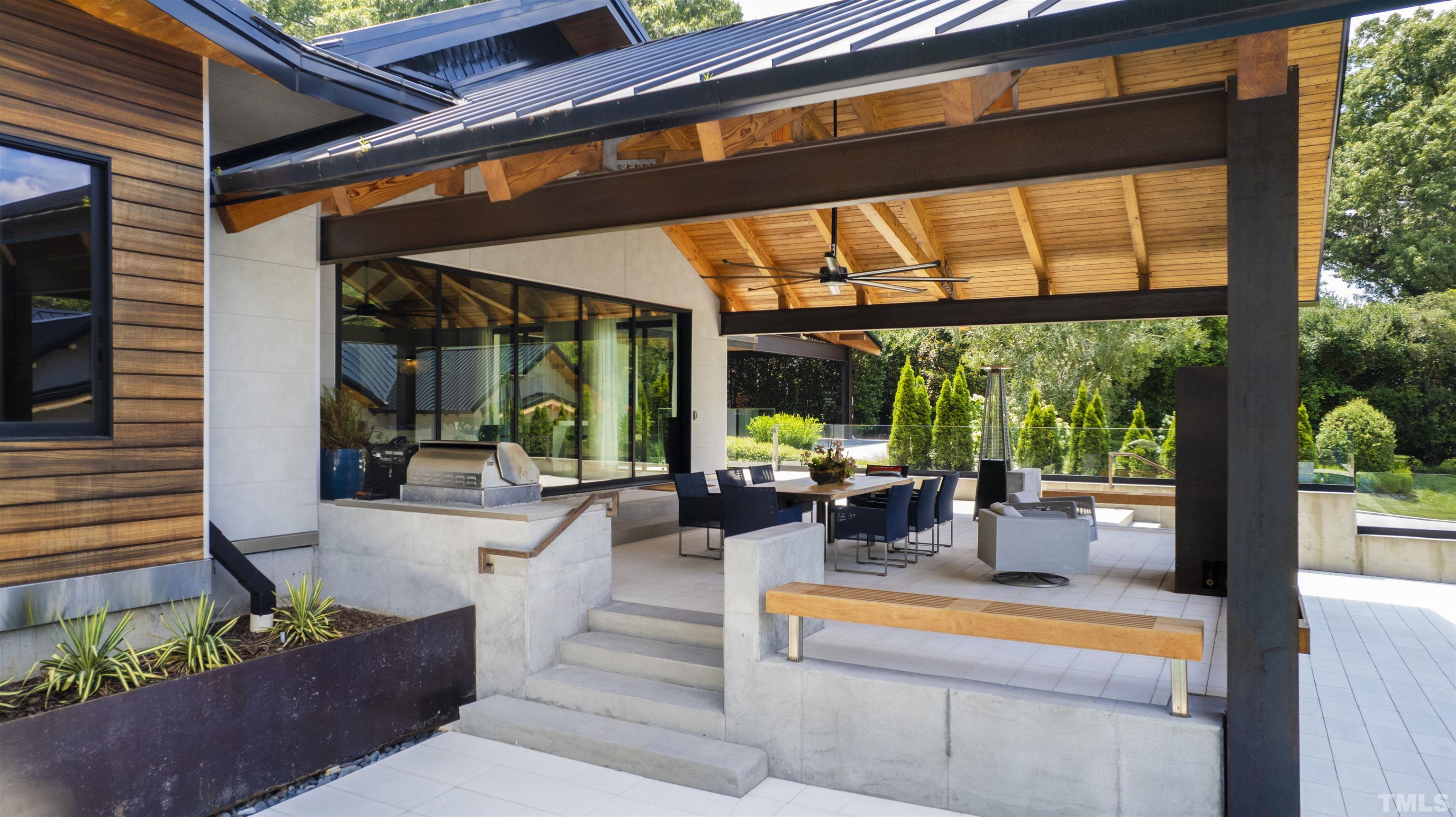 2315 Beechridge Road Raleigh, NC 27608 - Photo 48 of 78 a building outdoor space with patio furniture and potted plants