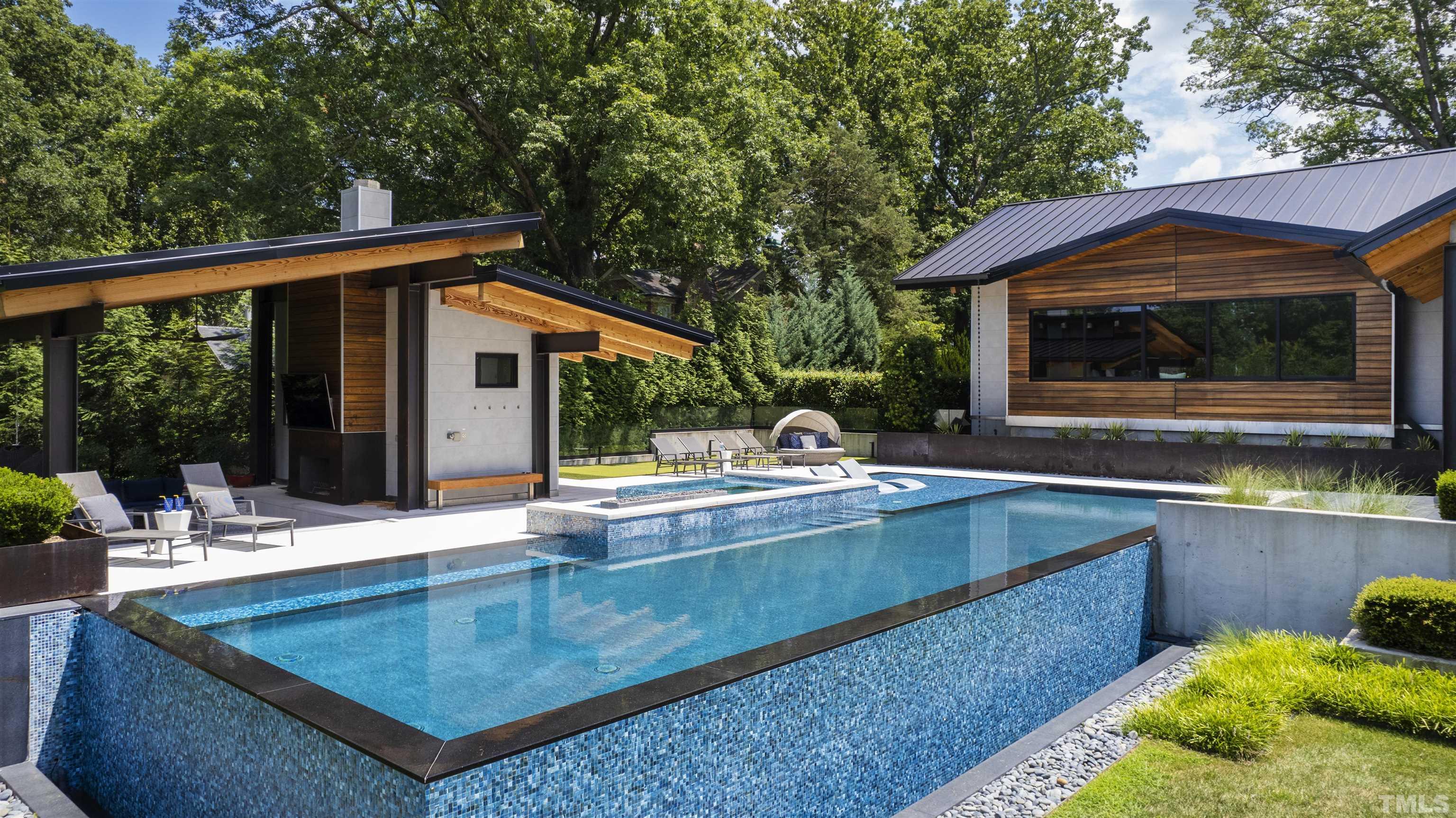 2315 Beechridge Road Raleigh, NC 27608 - Photo 50 of 78 a view of house with swimming pool and a yard