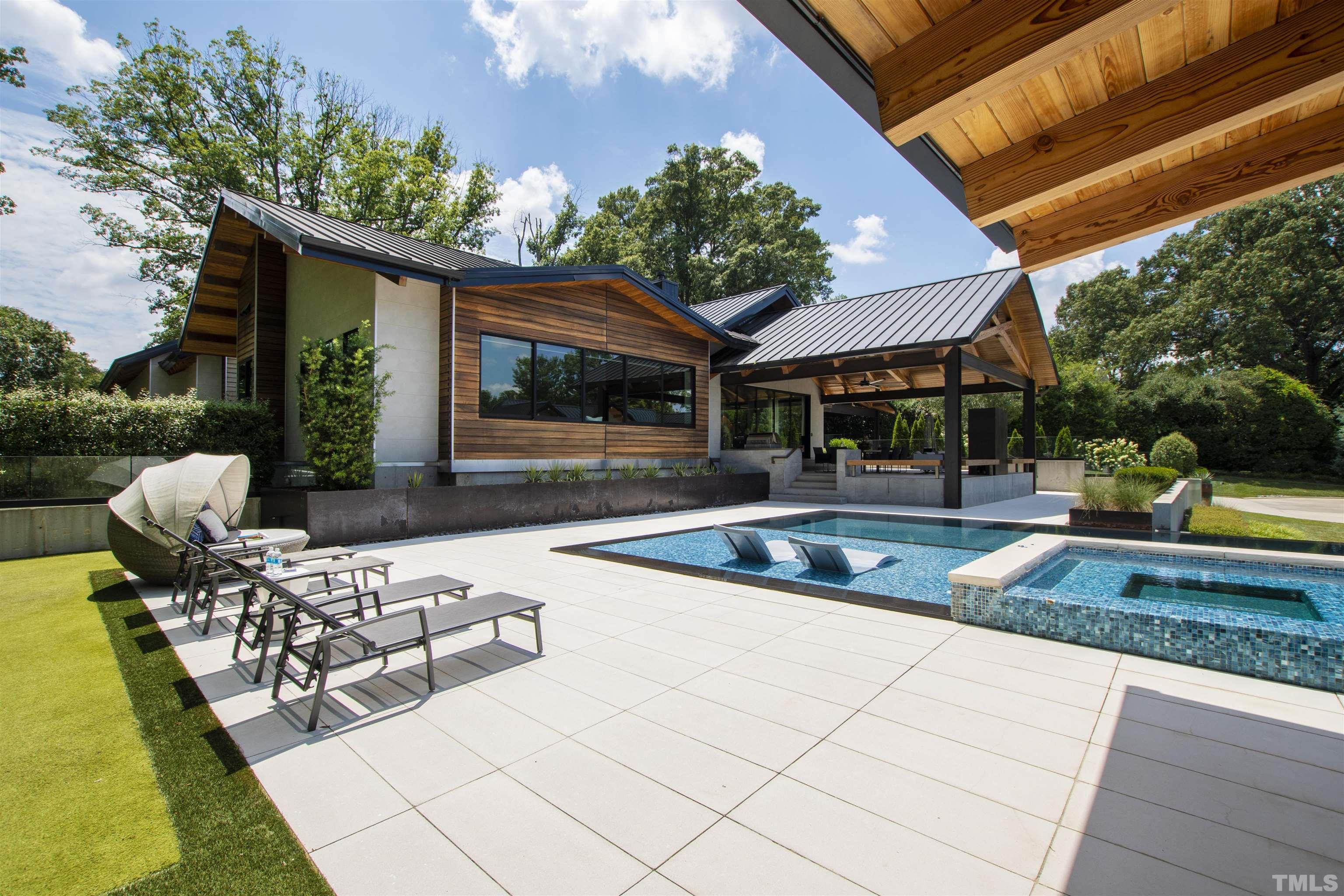 2315 Beechridge Road Raleigh, NC 27608 - Photo 51 of 78 a view of a house with swimming pool and sitting area