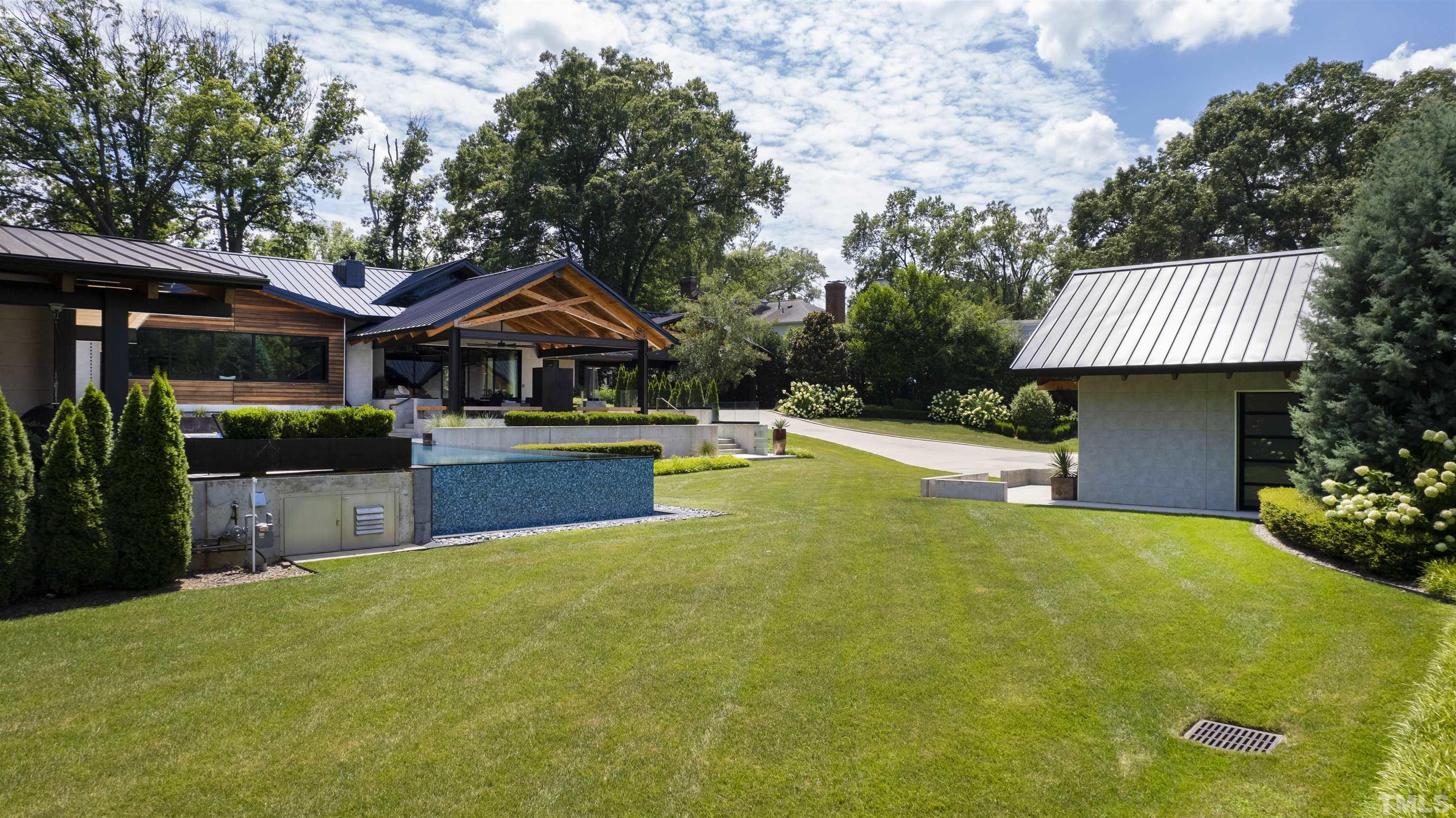 2315 Beechridge Road Raleigh, NC 27608 - Photo 59 of 78 a front view of house with yard and swimming pool