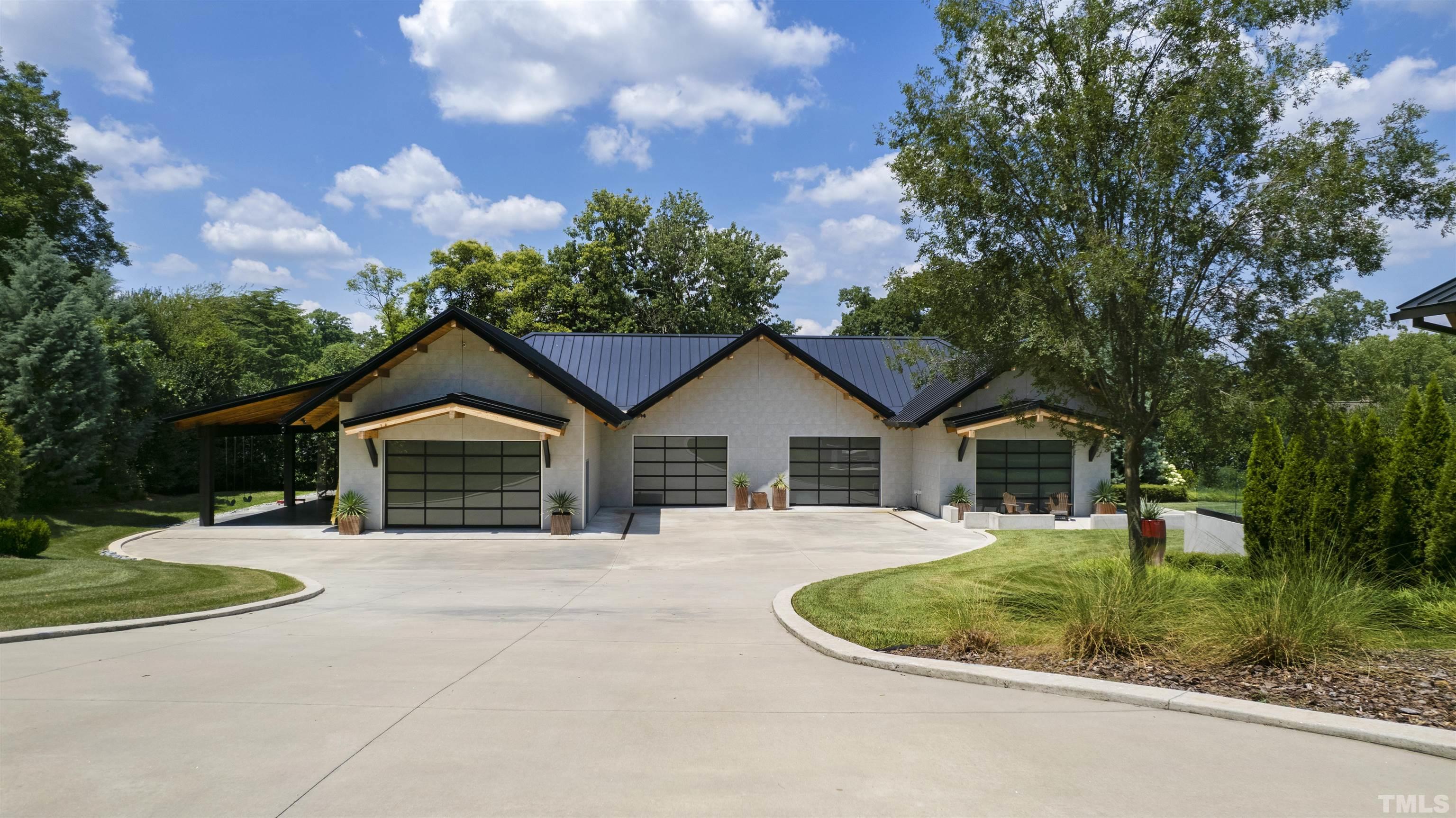 2315 Beechridge Road Raleigh, NC 27608 - Photo 61 of 78 a front view of a house with a yard and trees
