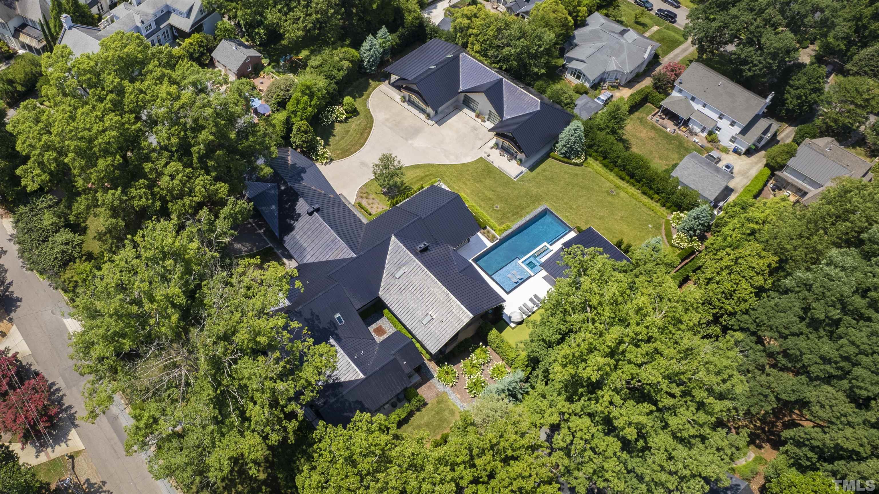 2315 Beechridge Road Raleigh, NC 27608 - Photo 73 of 78 an aerial view of a house with swimming pool and garden space