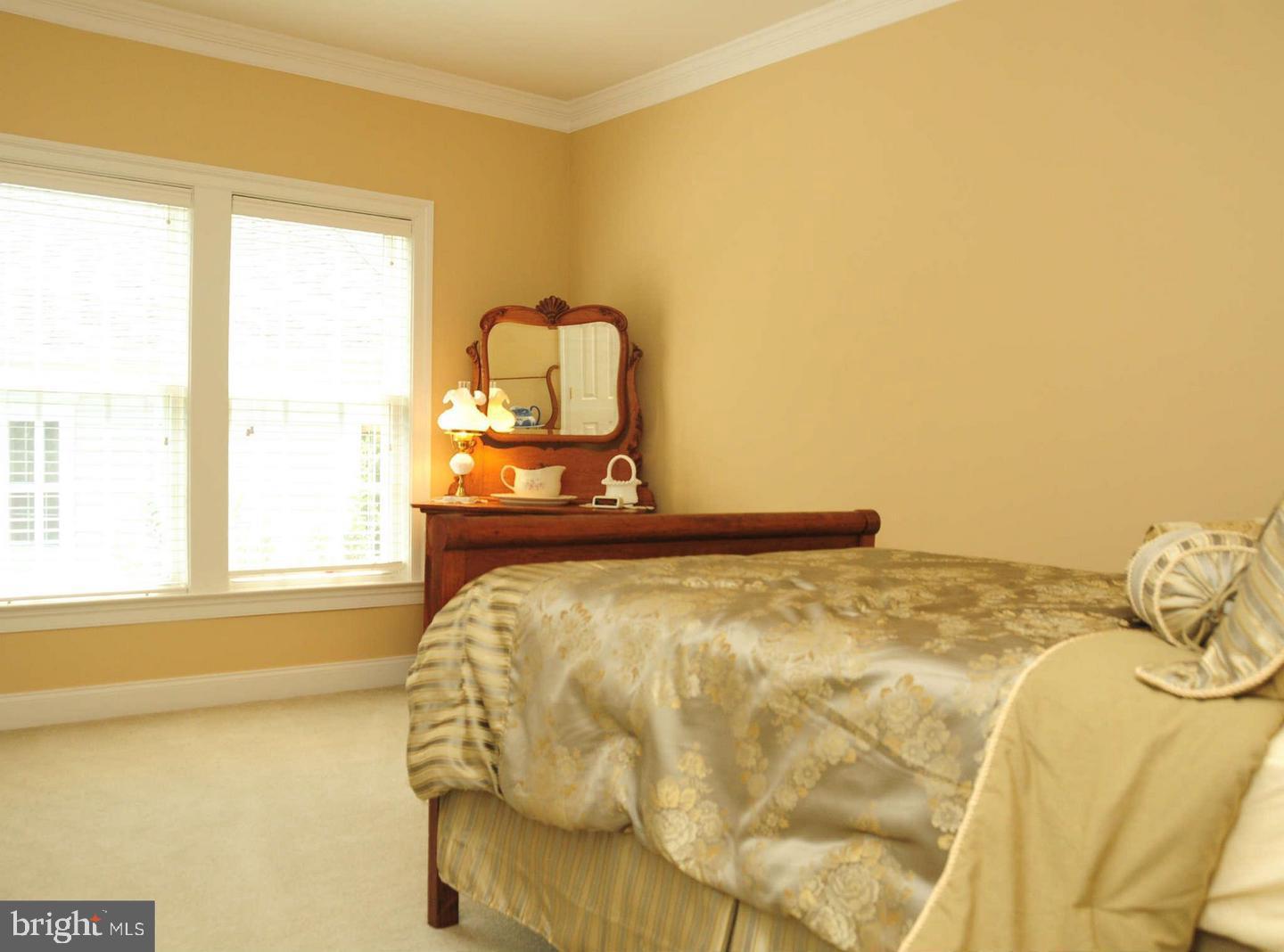19123 Stream Crossing Court Leesburg, VA 20176 - Photo 14 of 30 a bedroom with a bed and window