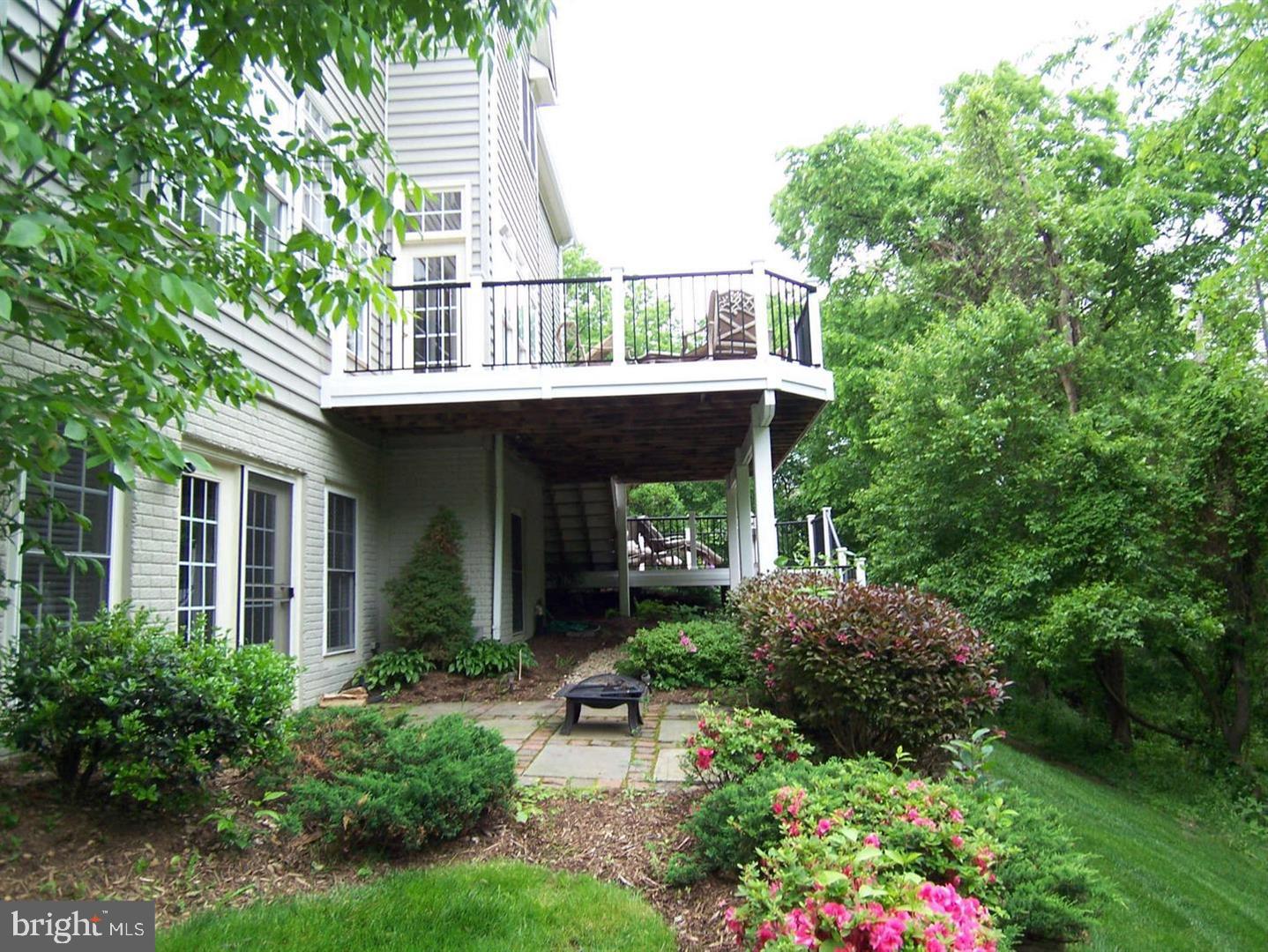 19123 Stream Crossing Court Leesburg, VA 20176 - Photo 20 of 30 a view of a house with balcony and garden