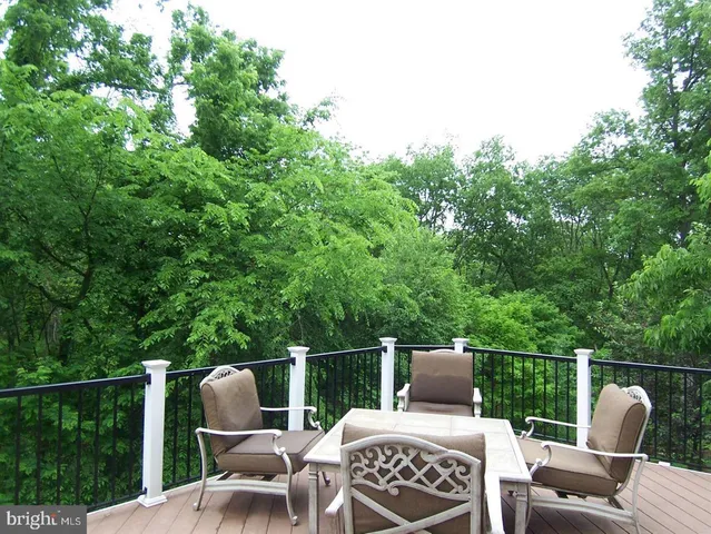 a view of a chairs and table in patio