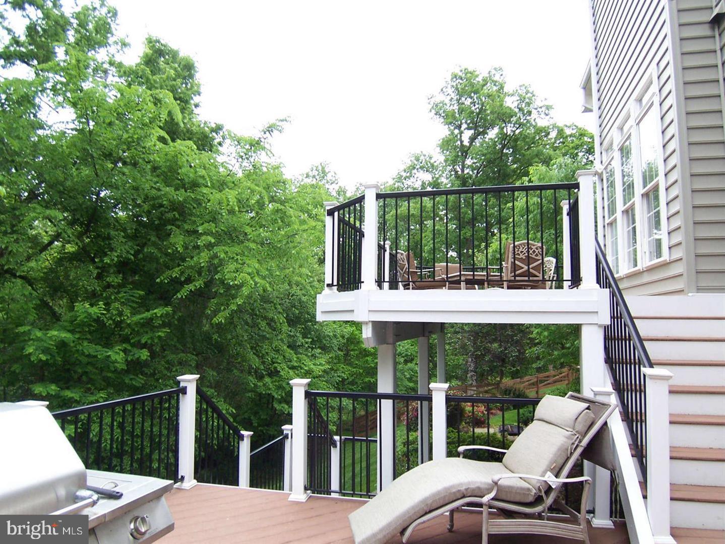 19123 Stream Crossing Court Leesburg, VA 20176 - Photo 23 of 30 a view of a chairs and table in patio