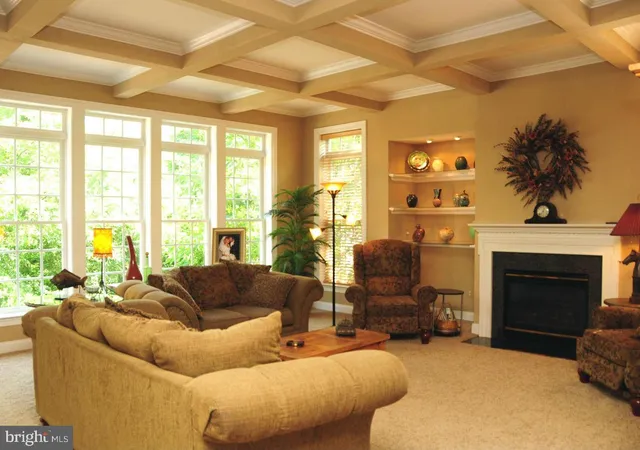 a kitchen with a sink and large windows