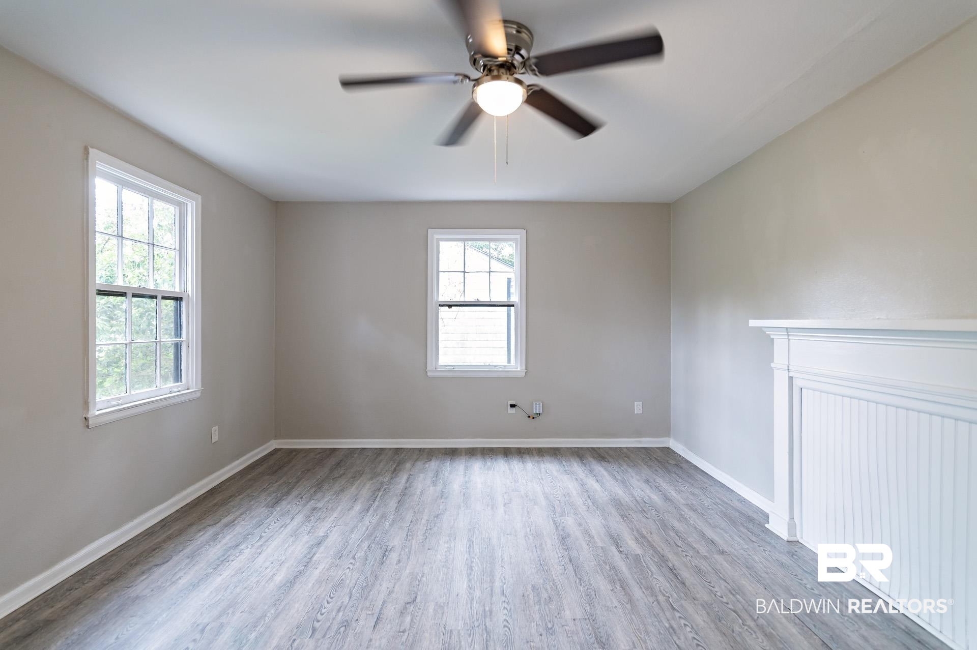 1869 Mott Drive West Mobile, AL 36617 - Photo 7 of 34 Spare room featuring baseboards, ceiling fan, and wood finished floors