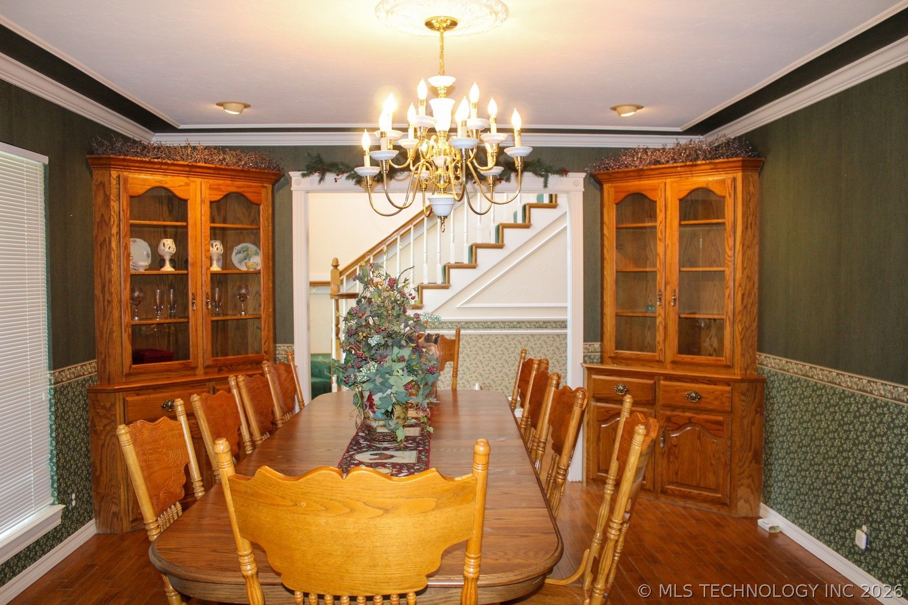 13248 North 3540th Road Maud, OK 74854 - Photo 52 of 98 Formal dining area featuring hardwood flooring and a multi-tiered chandelier