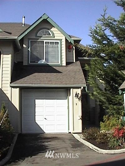 821 Sunset Boulevard Northeast, Unit C3 Renton, WA 98056 - Photo 1 of 1 a front view of a house with a yard