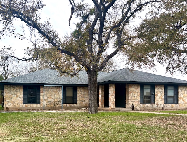 a front view of a house with garage