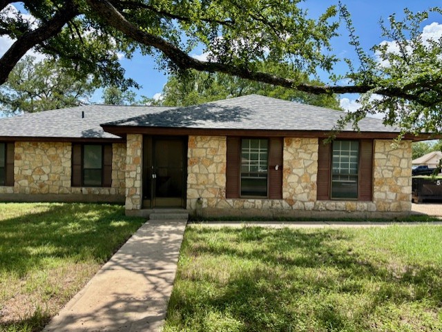 3416 Primrose Trail Georgetown, TX 78628 - Photo 2 of 35 a front view of a house with a garden