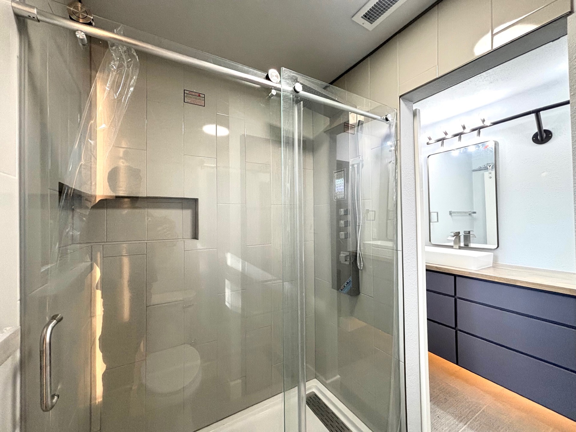 3416 Primrose Trail Georgetown, TX 78628 - Photo 28 of 35 a bathroom with a shower and a mirror