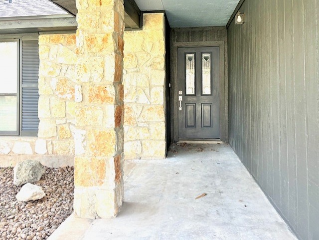3416 Primrose Trail Georgetown, TX 78628 - Photo 3 of 35 a view of entryway with wooden floor and a livingroom