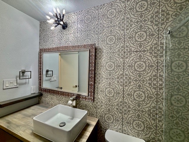 3416 Primrose Trail Georgetown, TX 78628 - Photo 35 of 35 a bathroom with a sink a mirror and shower