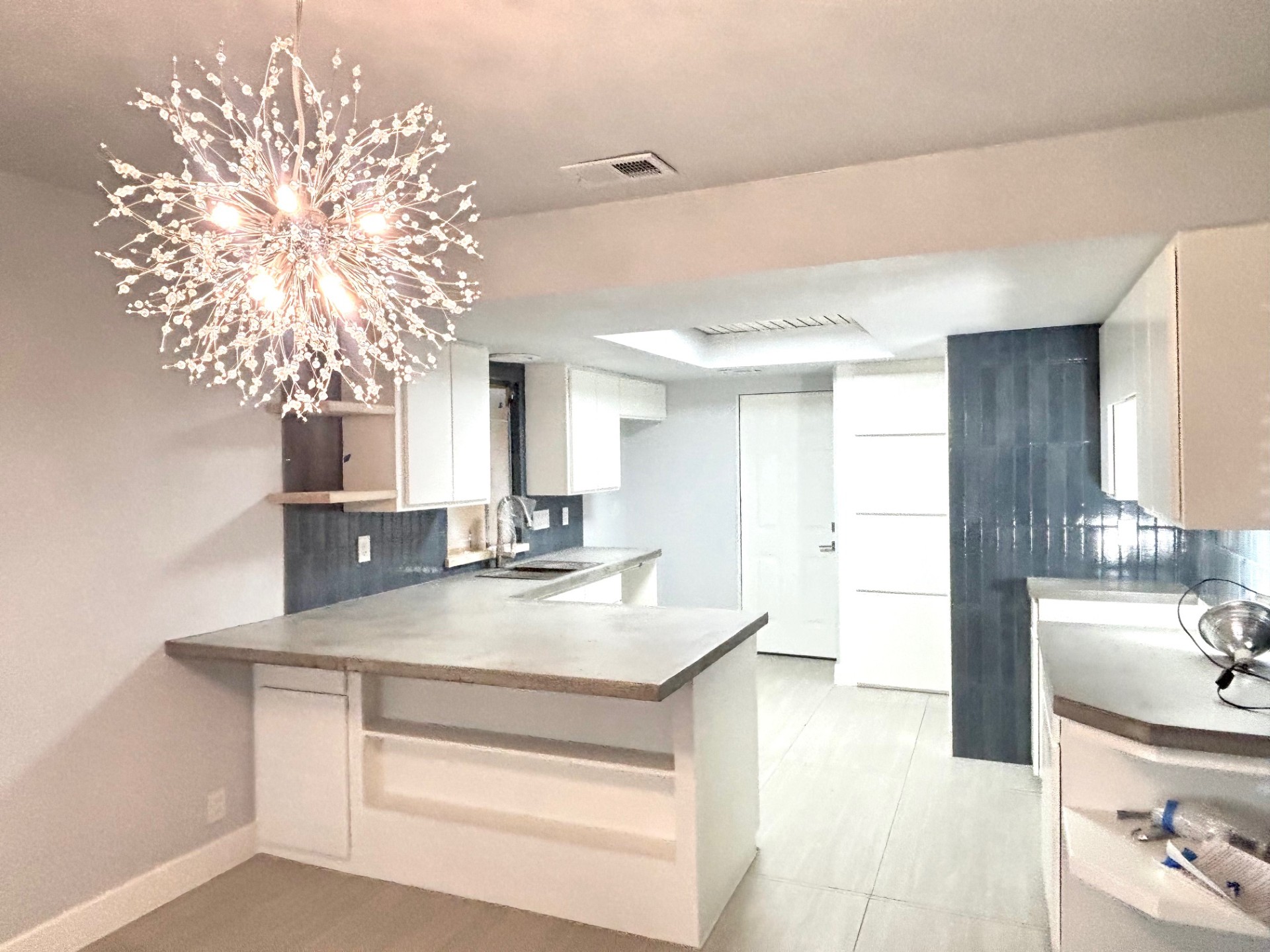 3416 Primrose Trail Georgetown, TX 78628 - Photo 8 of 35 a kitchen with a sink and a mirror