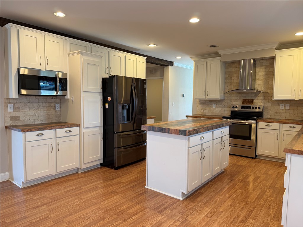 375 Trail Ridge Drive Sandia, TX 78383 - Photo 4 of 17 a kitchen with granite countertop a refrigerator stove top oven and sink