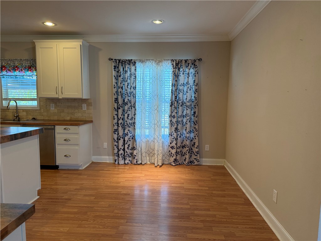 375 Trail Ridge Drive Sandia, TX 78383 - Photo 5 of 17 a view of kitchen with window and hardwood floor