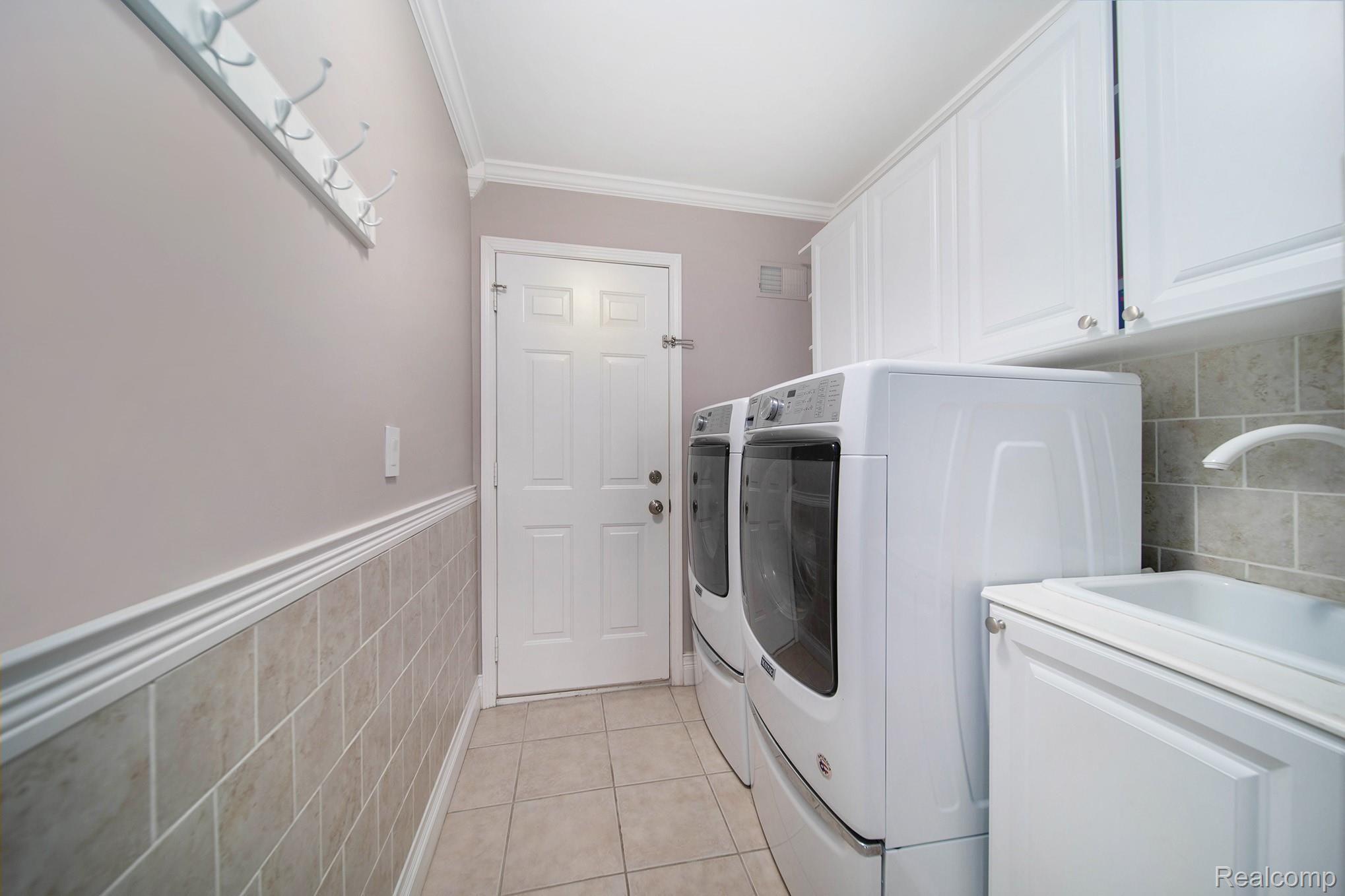 3438 Cascade Circle Rochester, MI 48307 - Photo 24 of 35 CERAMIC 1ST FLR LAUNDRY W/ CABINETS & NEWER APPLIANCES