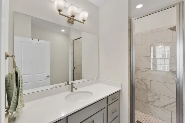 a bathroom with a sink toilet and shower