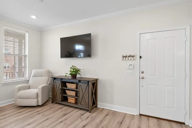 a view of a dining room with furniture and wooden floor