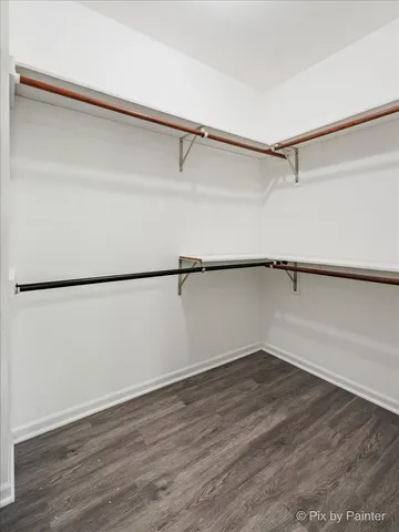 a view of a room with an empty walk in closet
