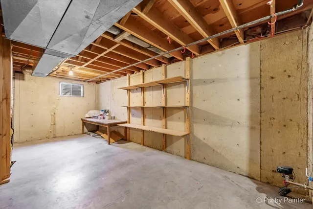 a view of a room with wooden walls and stairs