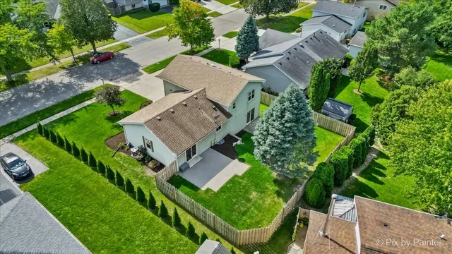 an aerial view of residential house with outdoor space