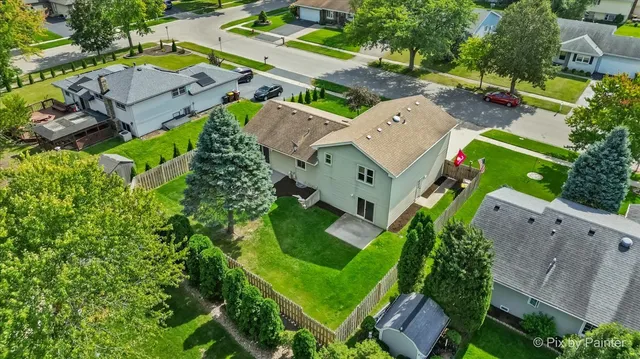 an aerial view of a house with a garden
