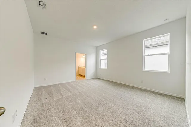 an empty room with windows