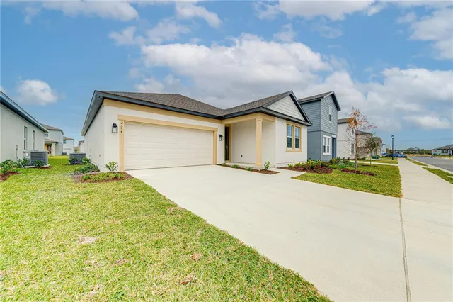 a view of an house with backyard and kitchen
