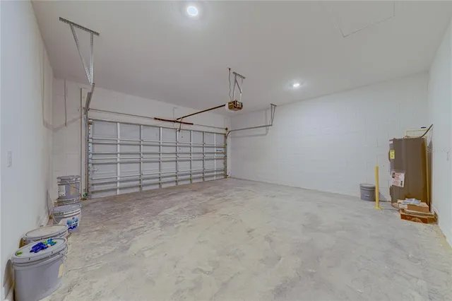 a view of a backyard with plants and a patio