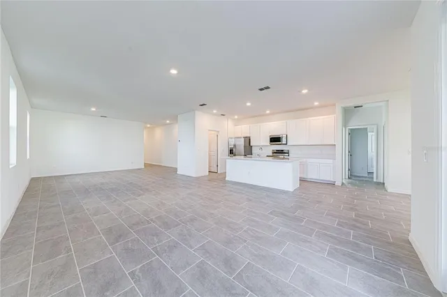 a view of a kitchen with a sink and cabinets