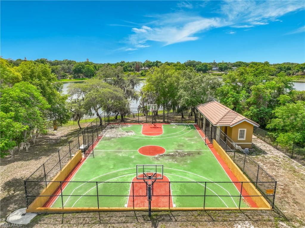 4210 South Hiawassee Road Orlando, FL 32835 - Photo 45 of 49 an aerial view of a tennis ground and a cars park side of the road