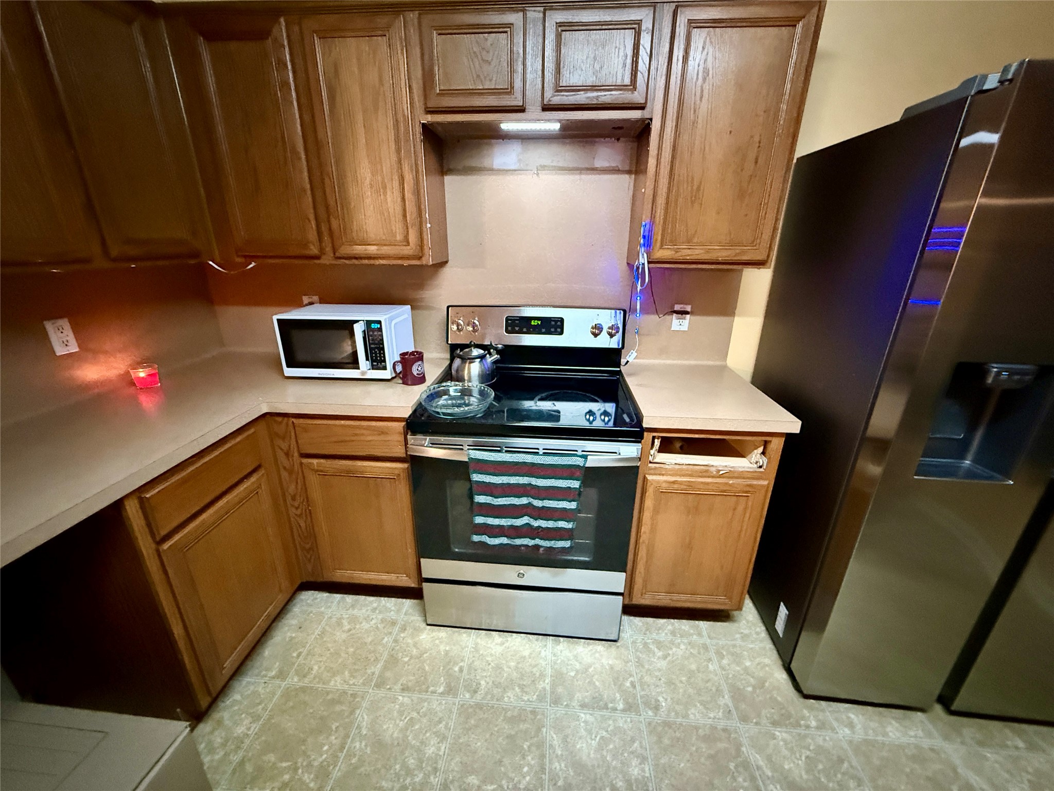 1022 Sycamore Ridge Lane Houston, TX 77073 - Photo 18 of 39 a kitchen with granite countertop a stove and a microwave