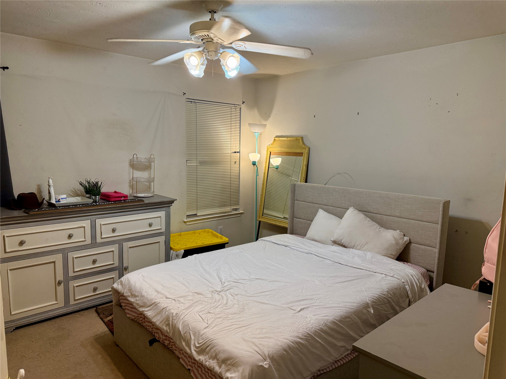 1022 Sycamore Ridge Lane Houston, TX 77073 - Photo 26 of 39 a bedroom with bed and a chandelier