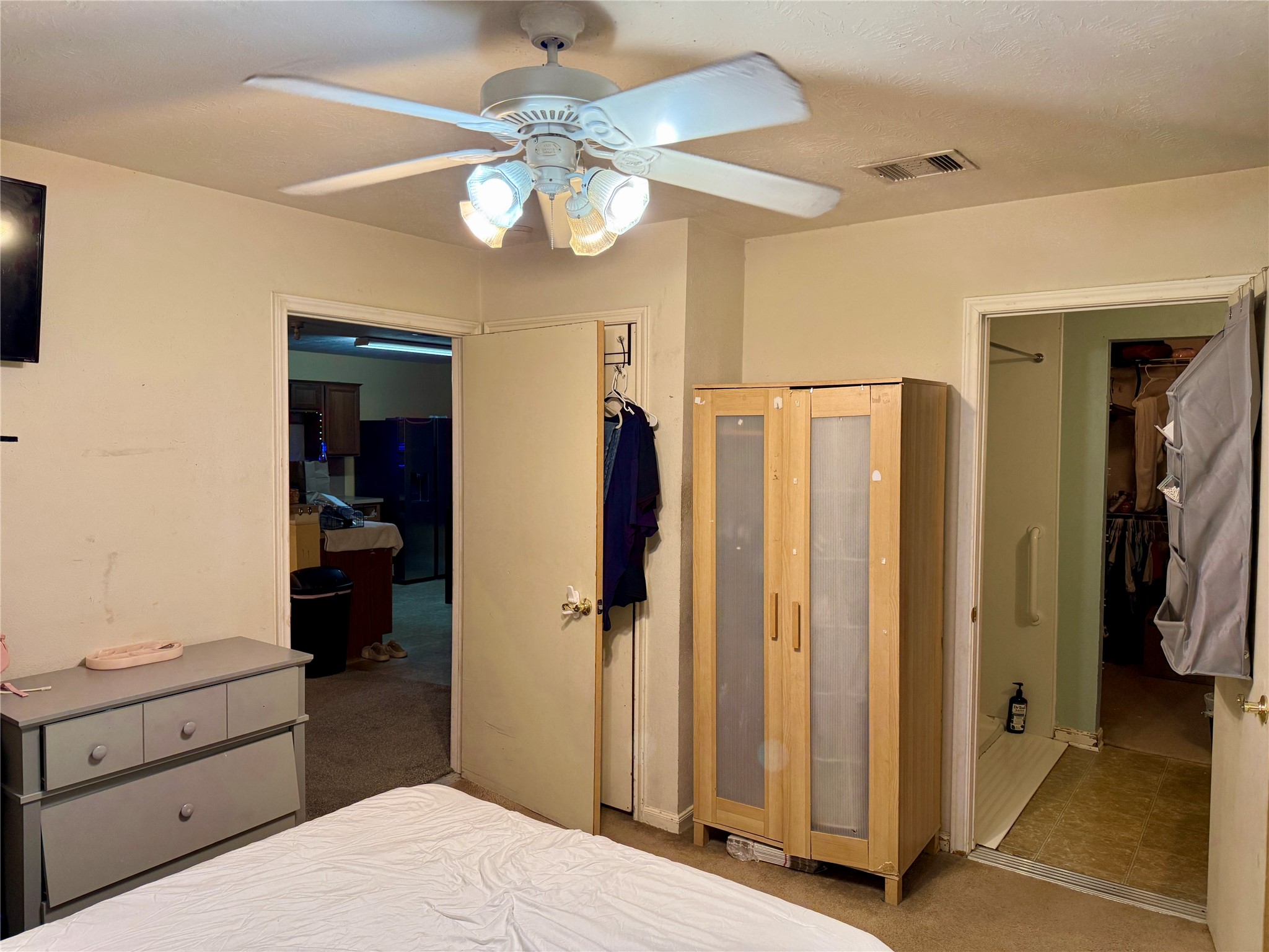 1022 Sycamore Ridge Lane Houston, TX 77073 - Photo 27 of 39 a bedroom with a bed and a chandelier
